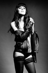 Black and white photography - model topless with leather jacket