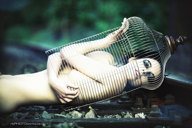 Model kept in a cage on railway